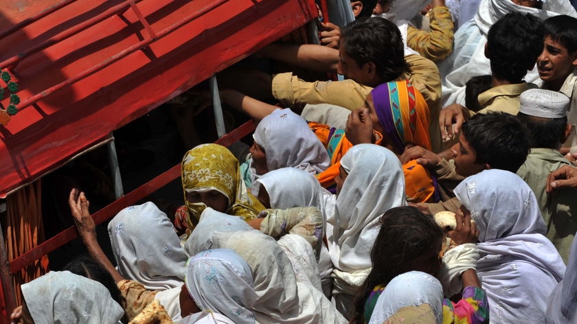 Flood survivors gather for food