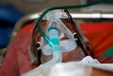 A patient waits to enter a COVID-19 hospital for treatment, amidst the spread of coronavirus in Ahmedabad.
