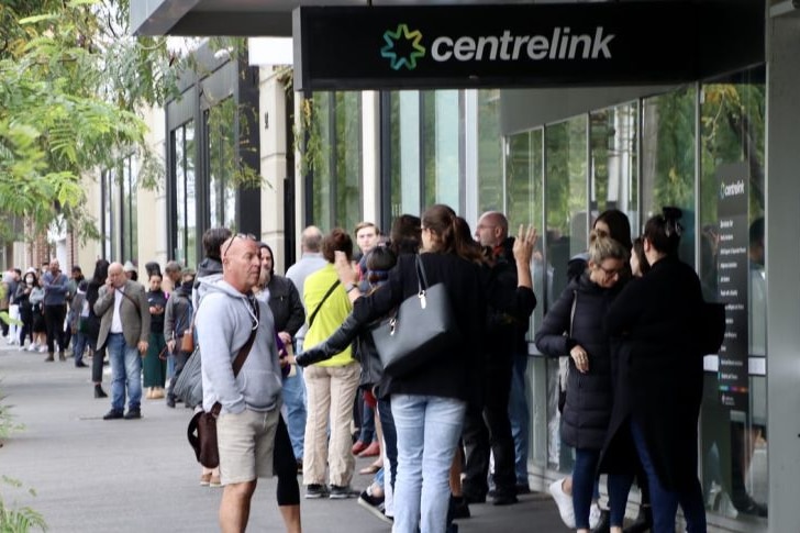 people queue up outside a Centrelink office