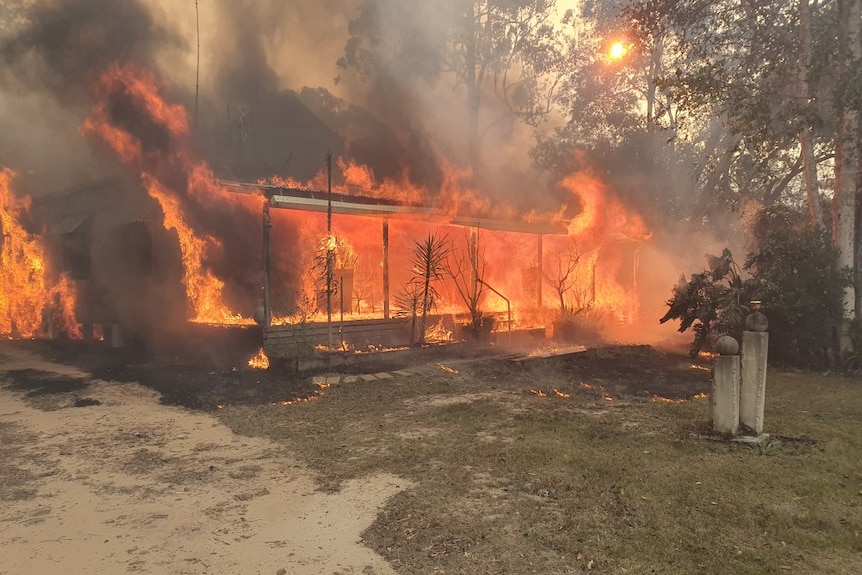 A house is engulfed by flames.