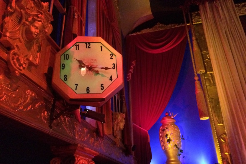 A gold statue and ornate clock inside the Laurieton Plaza Theatre's main cinema are among the decorations.