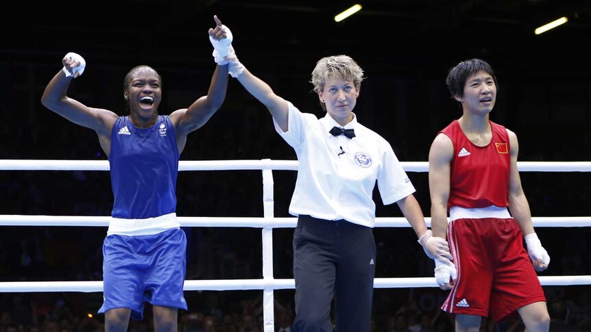 Britain's Nicola Adams  declared the winner over China's Ren Cancan