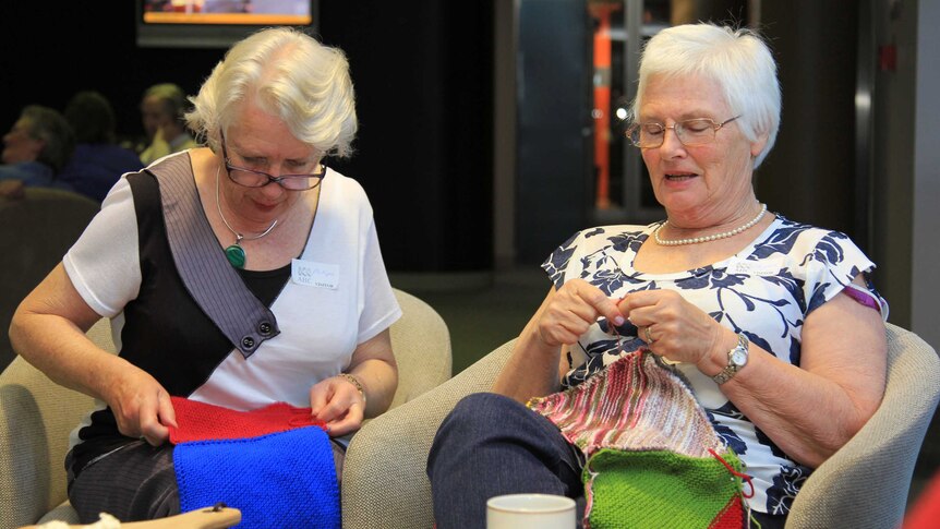 Two women knitting