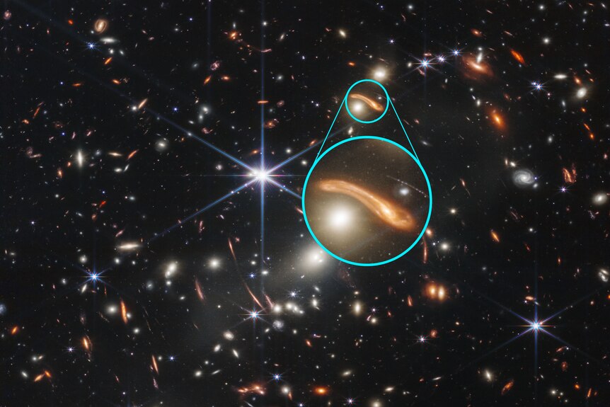 Small, bent red-looking galaxies are highlighted and magnified