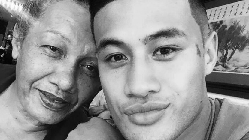 A close-up selfie of an older Samoan woman and a young Samoan man. Both have slight smiles on their faces.