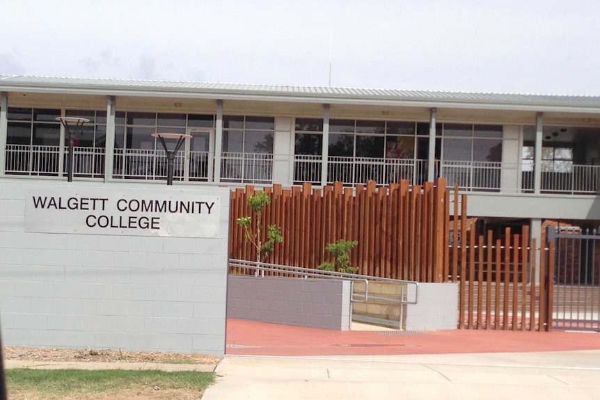 A large white building with Walgett Community College written on the front.