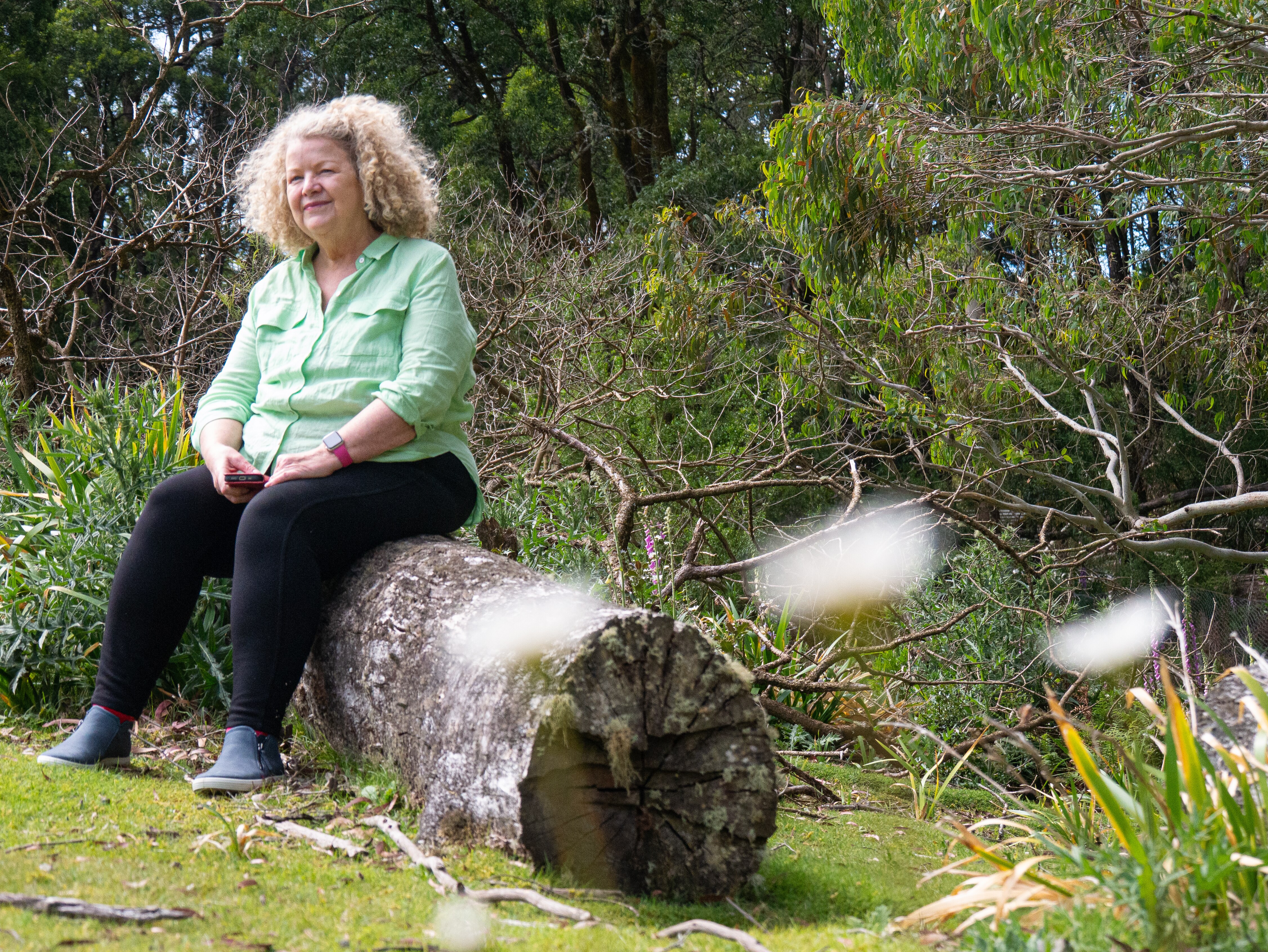 Woman in a field of daisies.