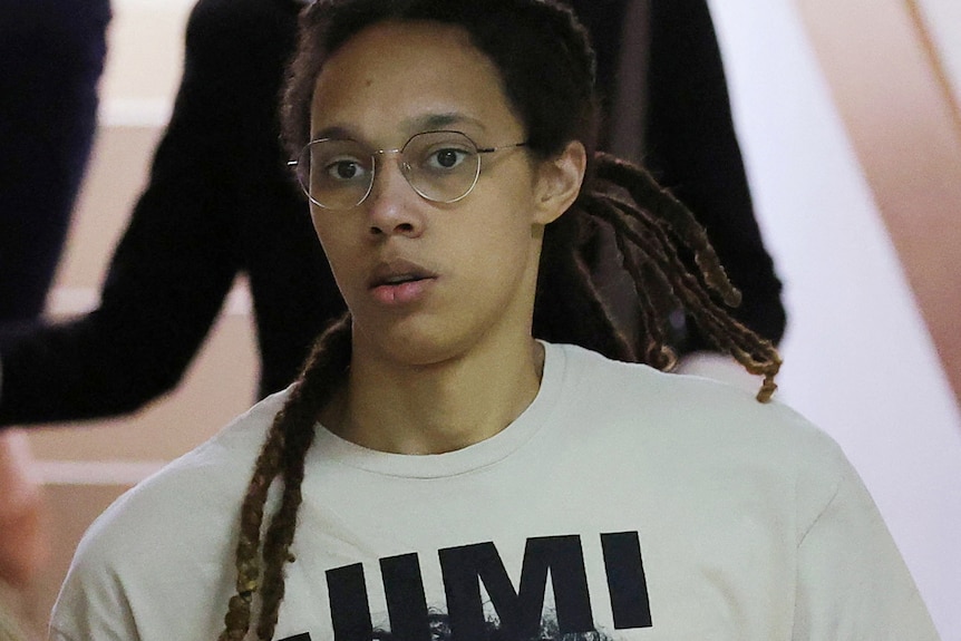 US.basketball player Brittney Griner shown wearing glasses and a white jumper.