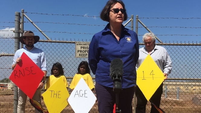 Matthew Littlejohn, Olga Haven and Rodney Dillon protest at the Don Dale detention centre in Darwin (L-R).