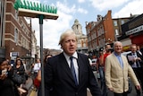 Boris Johnson joins riots clean-up
