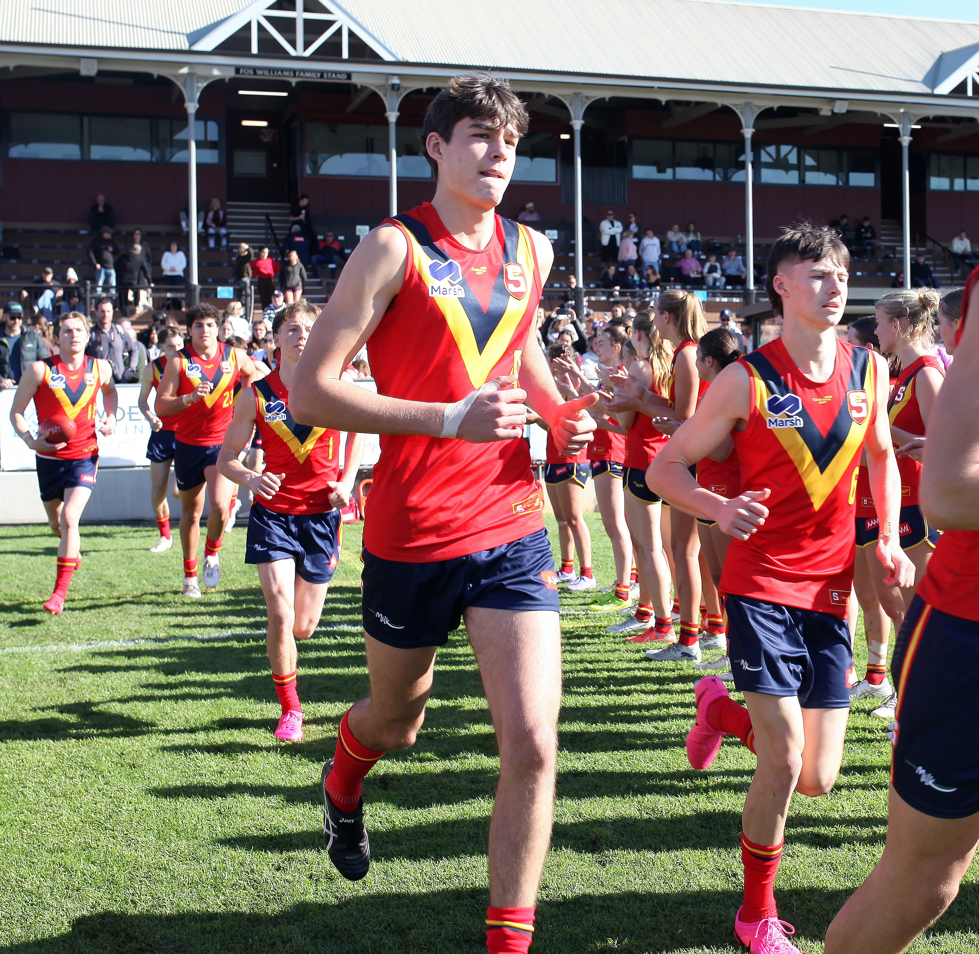 Broken back prompts apprentice electrician to chase footy career
