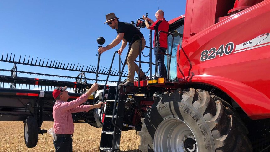 Scott Jericho from Case IH works with Tim Gentle on a header to film a 360-degree video.