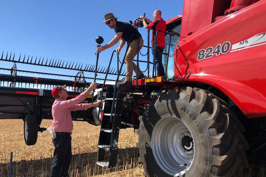 Scott Jericho from Case IH works with Tim Gentle on a header to film a 360-degree video.