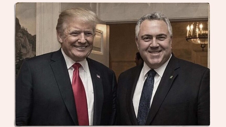 Mr Trump and Mr Hockey are both smiling. Mr Trump wears a red tie, while Mr Hockey wears blue.