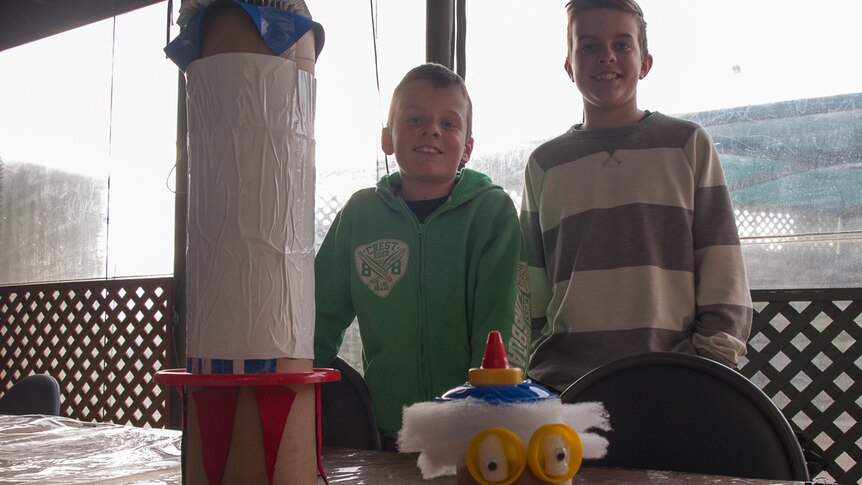 Marcus, 11, and Troyden Bristow, 13, with their rocket ship and Nutty Professor creations.