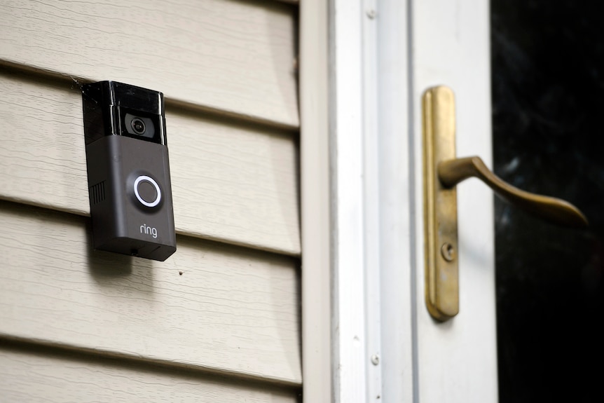 a ring doorbell installed on a weatherboard home