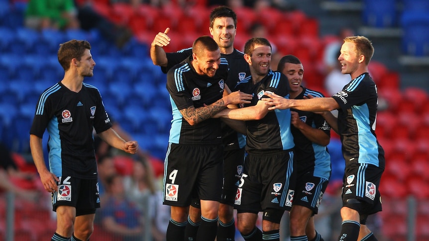 Generic shot of Sydney FC players celebrating in away strip
