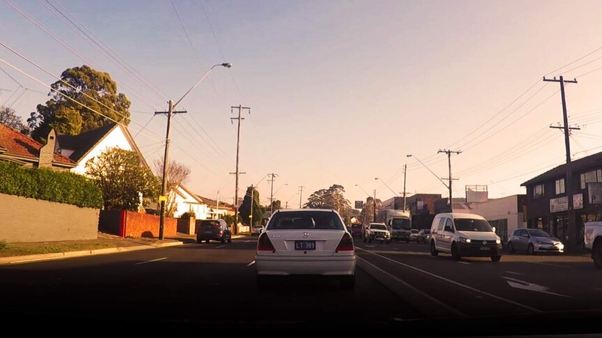 Car drives along a Sydney  bridge under a large tunnel. It is part of Adam Rosewarne's commute