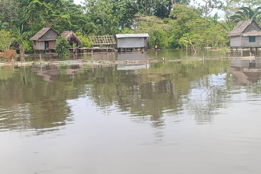 Floodwaters are high in a village in Papua New Guinea's East Sepik province. 