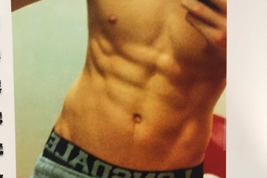 A photo of a man's rippled abs.