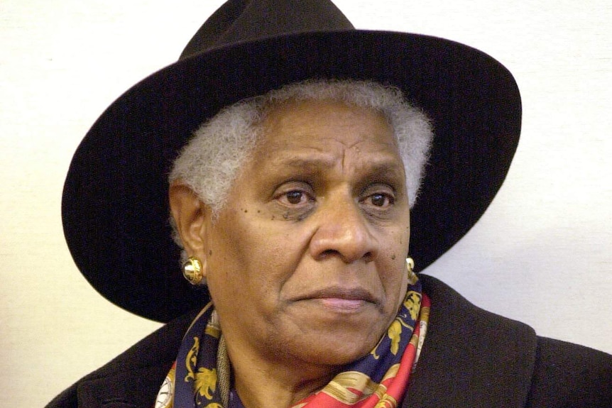 Close up of Evelyn Scott wearing a scarf and hat.