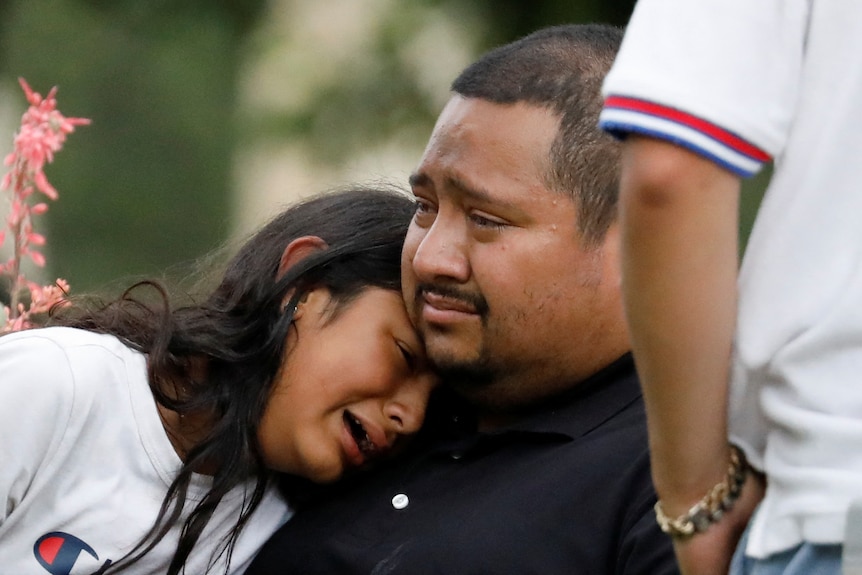 People react outside the Ssgt Willie de Leon Civic Center