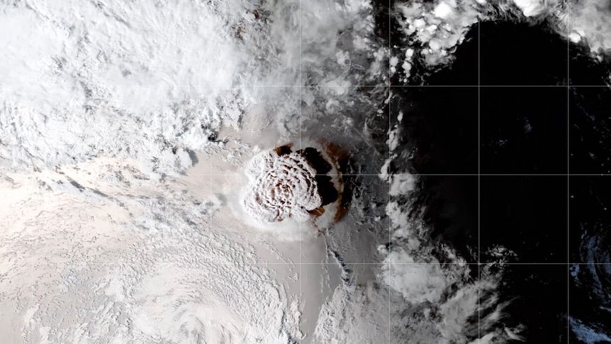 A satellite view of a volcano spewing a plume of ash into the atmosphere