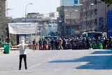 A protester faces riot police at Khalidia
