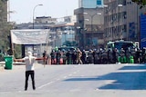 A protester faces riot police at Khalidia.