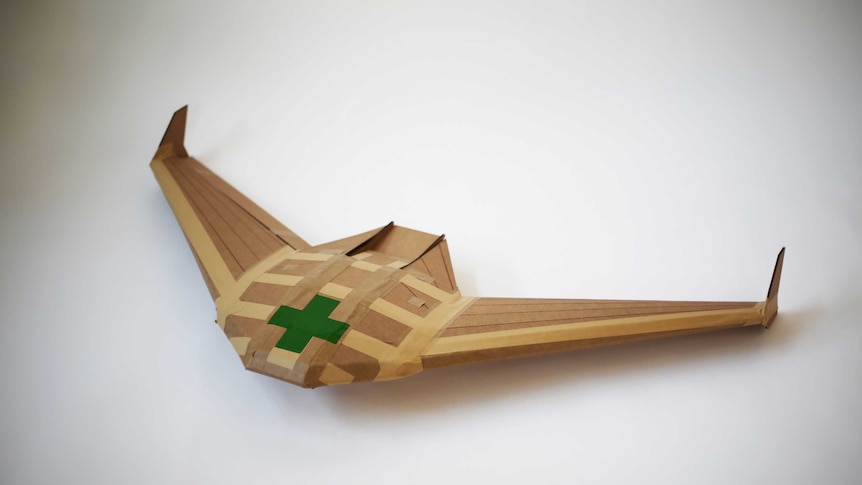 A small disposable cardboard glider, designed to help deliver aid.