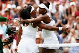Serena Williams hugs Venus Williams after their fourth round match at Wimbledon.