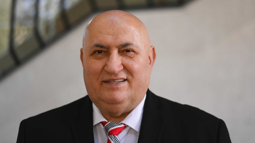 Milorad Trkulja, who is locked in a legal battle against Google, poses outside the High Court of Australia.