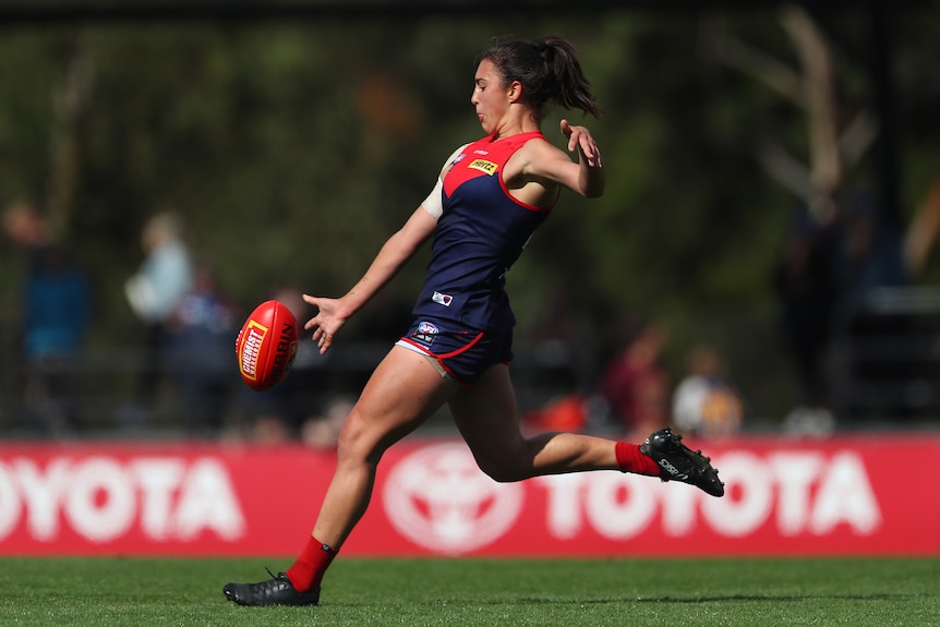 Brenna Tarrant kicks the ball.