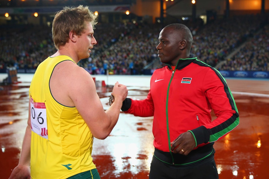 Peacock congratulates Yego after javelin