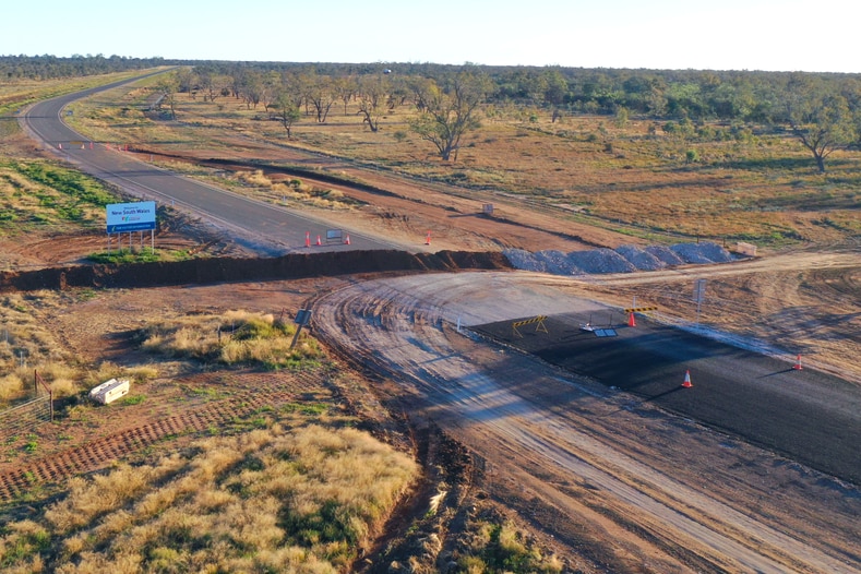 A mound of dirt covers an outback road in Hebel