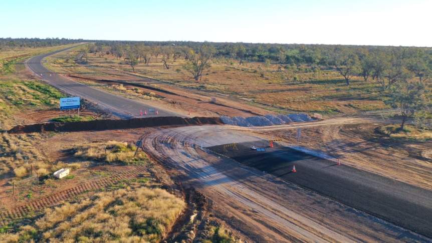 A mound of dirt ploughed across an outback roadway.