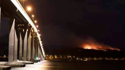 A bushfire in scrubland burnt close to Hobart's Government House.