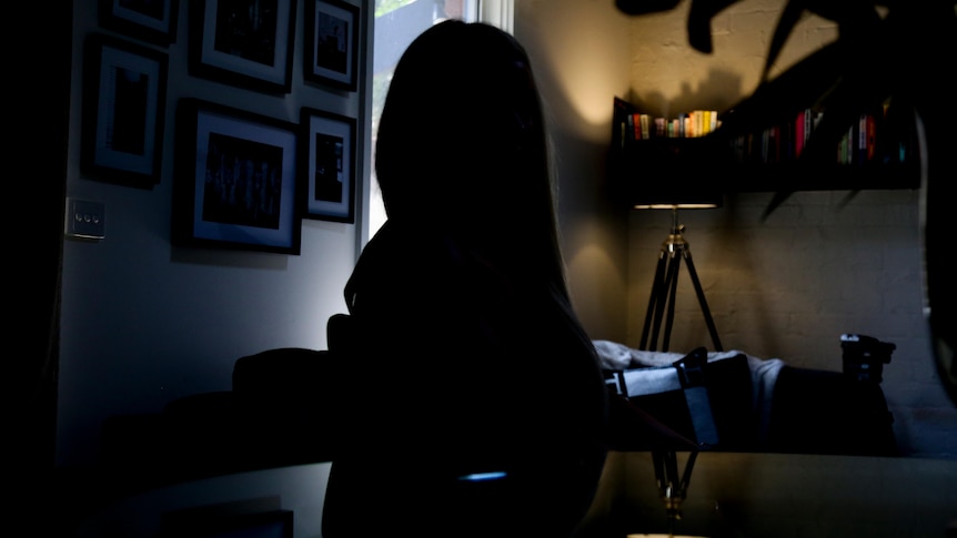 A dark silhouette of a woman 