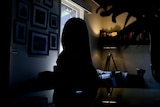 A dark silhouette of a woman 