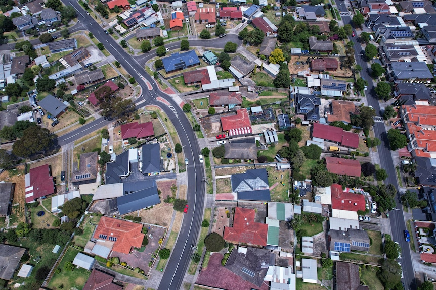 An aerial view of suburban streets in daylight.