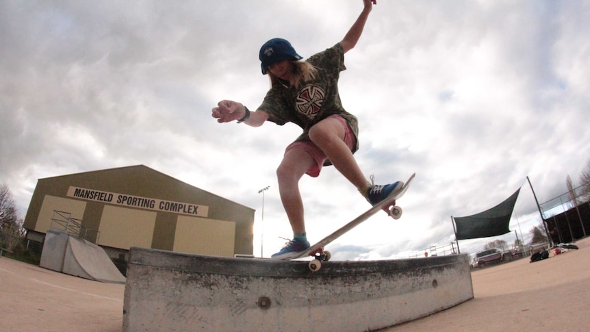 Hayley Wilson does a skateboard trick at the Mansfield Skate Park