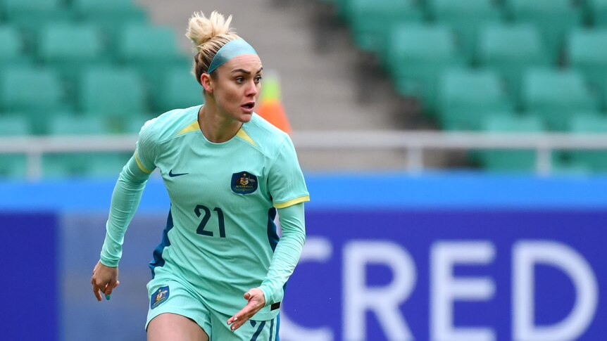 Australia's Ellie Carpenter dribbles a soccer ball during an Olympic qualifier against Uzbekistan.