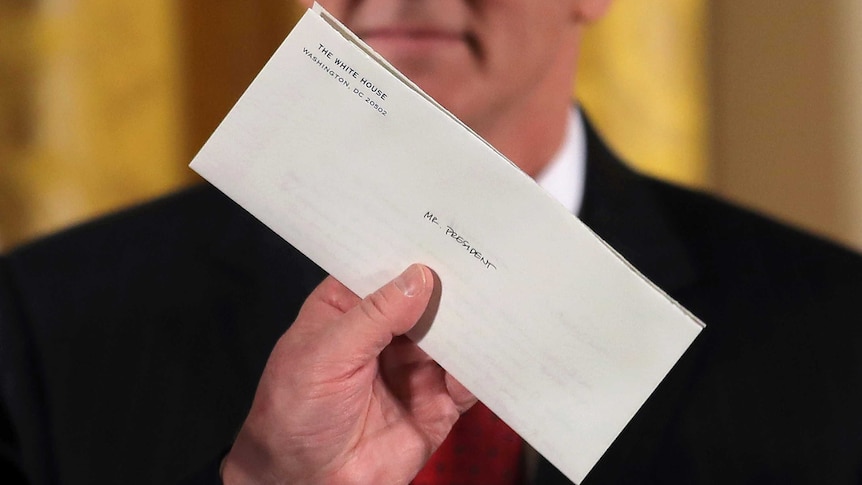A closeup of a closed letter with the words Mr President written on it.