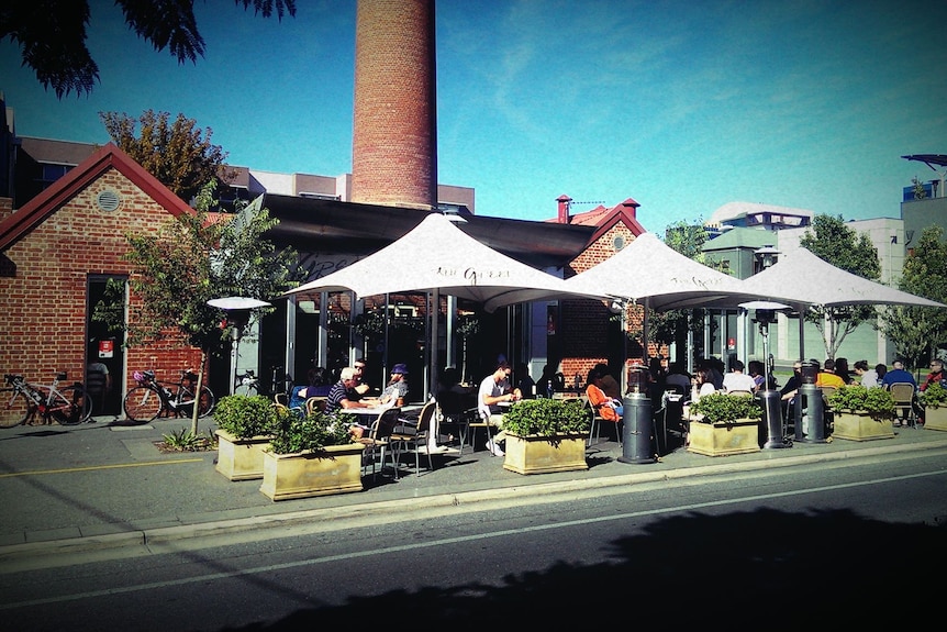 A restaurant with outdoor umbrellas