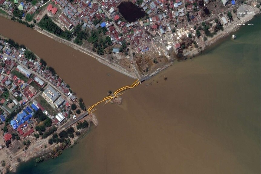 This October 1, 2018, satellite photo provided by DigitalGlobe shows a view of the Jembalan Bridge in Palu, Indonesia.
