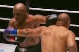 Mike Tyson throws a left jab a Roy Jones Jr in their exhibition fight.