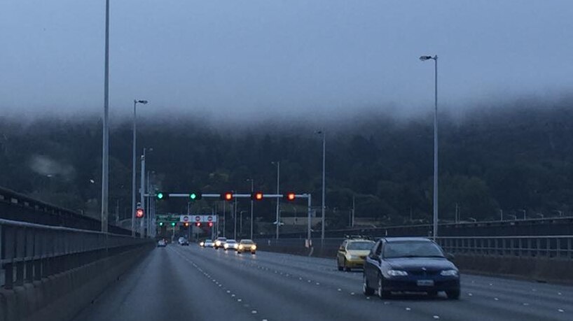 Christmas Eve fog rolls in over Hobart's Tasman Bridge.