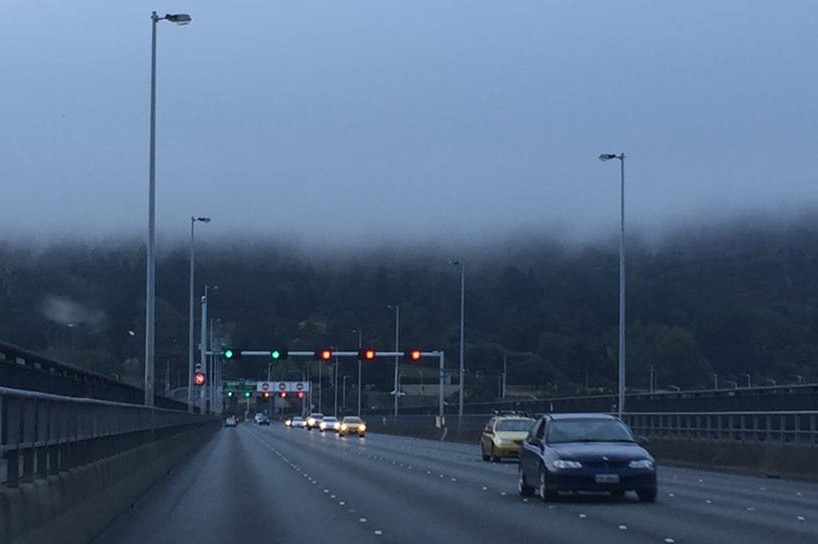 Christmas Eve fog rolls in over Hobart's Tasman Bridge.
