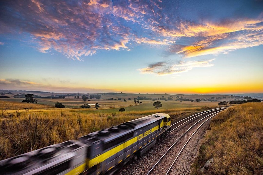 Train heading east through the rolling hills of Central West NSW. 