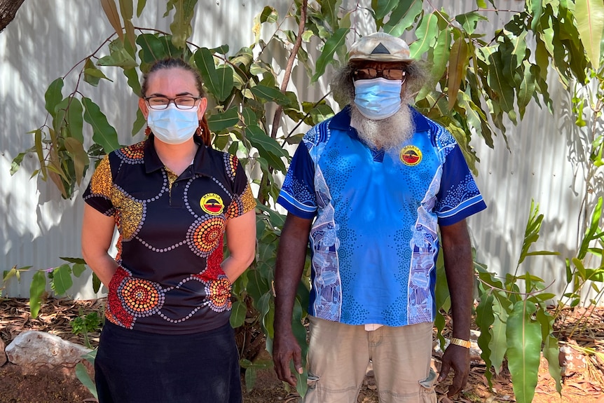 An Indigenous woman and man stand next to each other. 